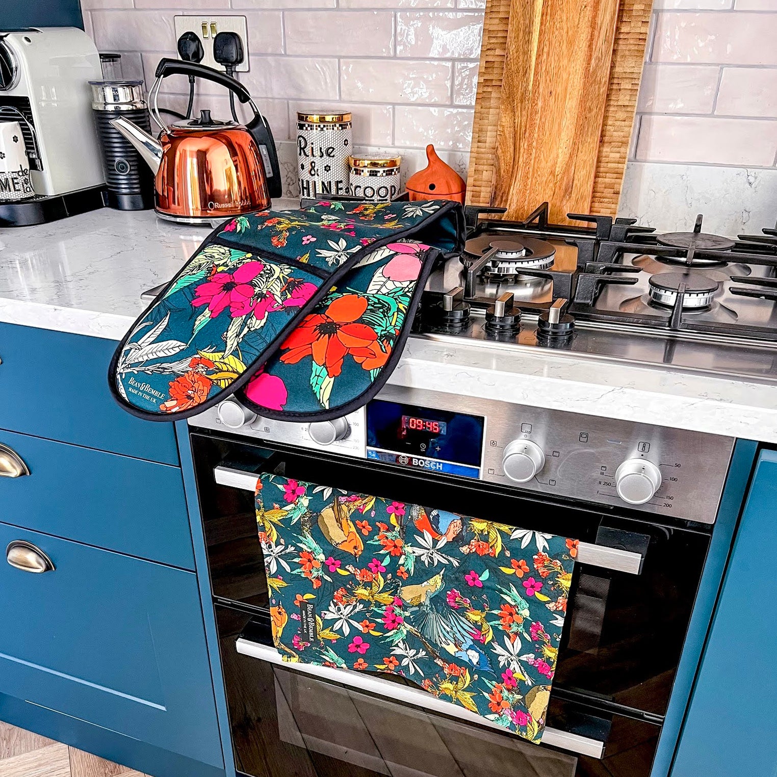 Little House in London blue kitchen with bird accessories; an oven glove and tea towel