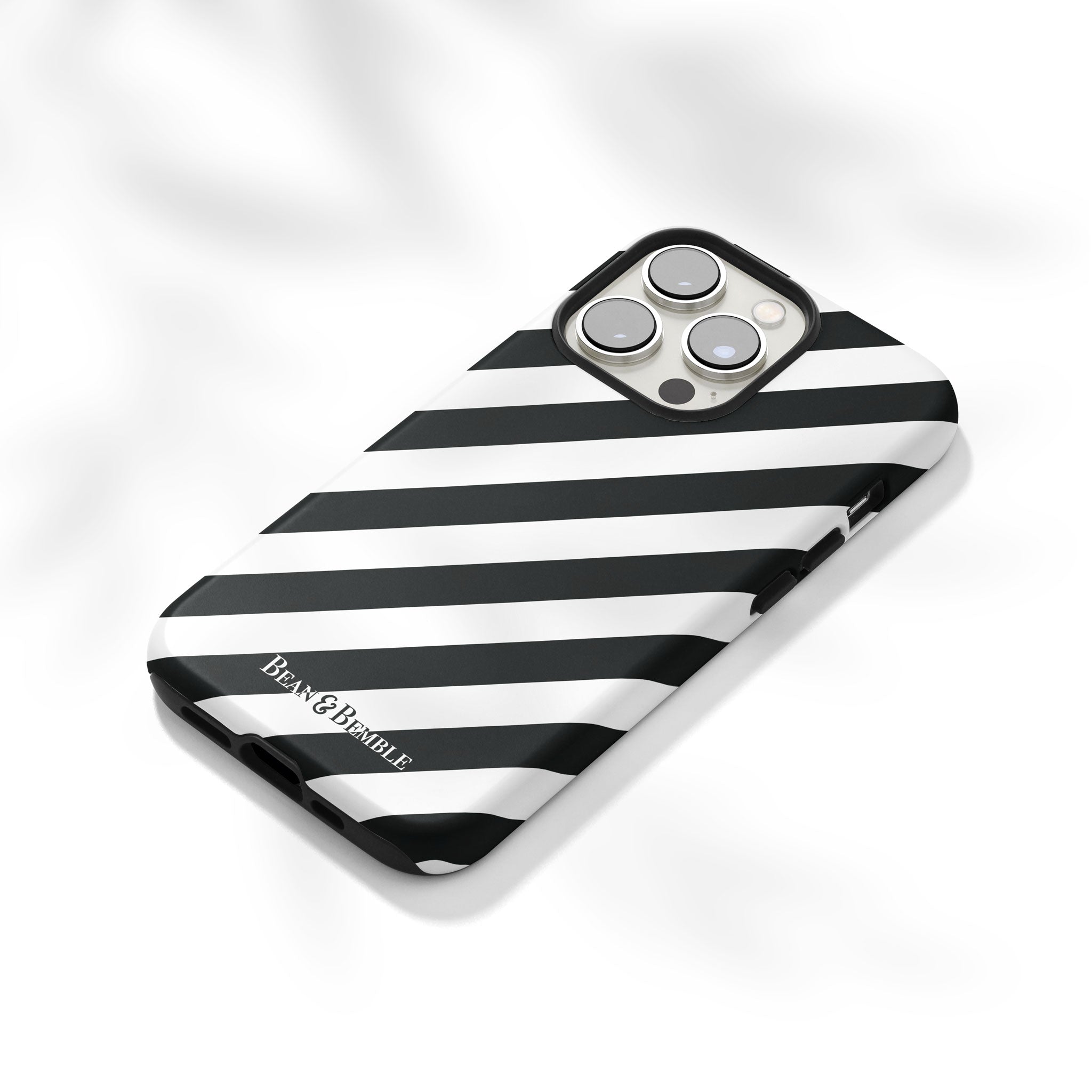 Angled photo of a black and white striped phone cover.  Tough for extra protection, printed in the UK to order