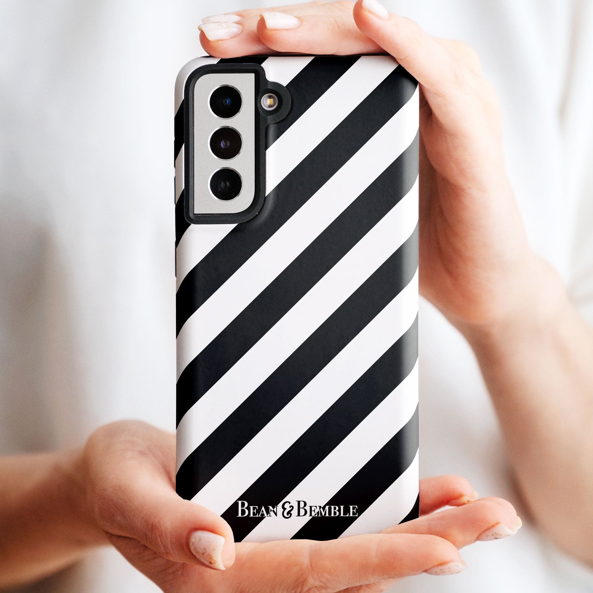 Black and white striped protective phone case for iPhone, Samsung Galaxy, Google Pixel, and LG - bold and modern design