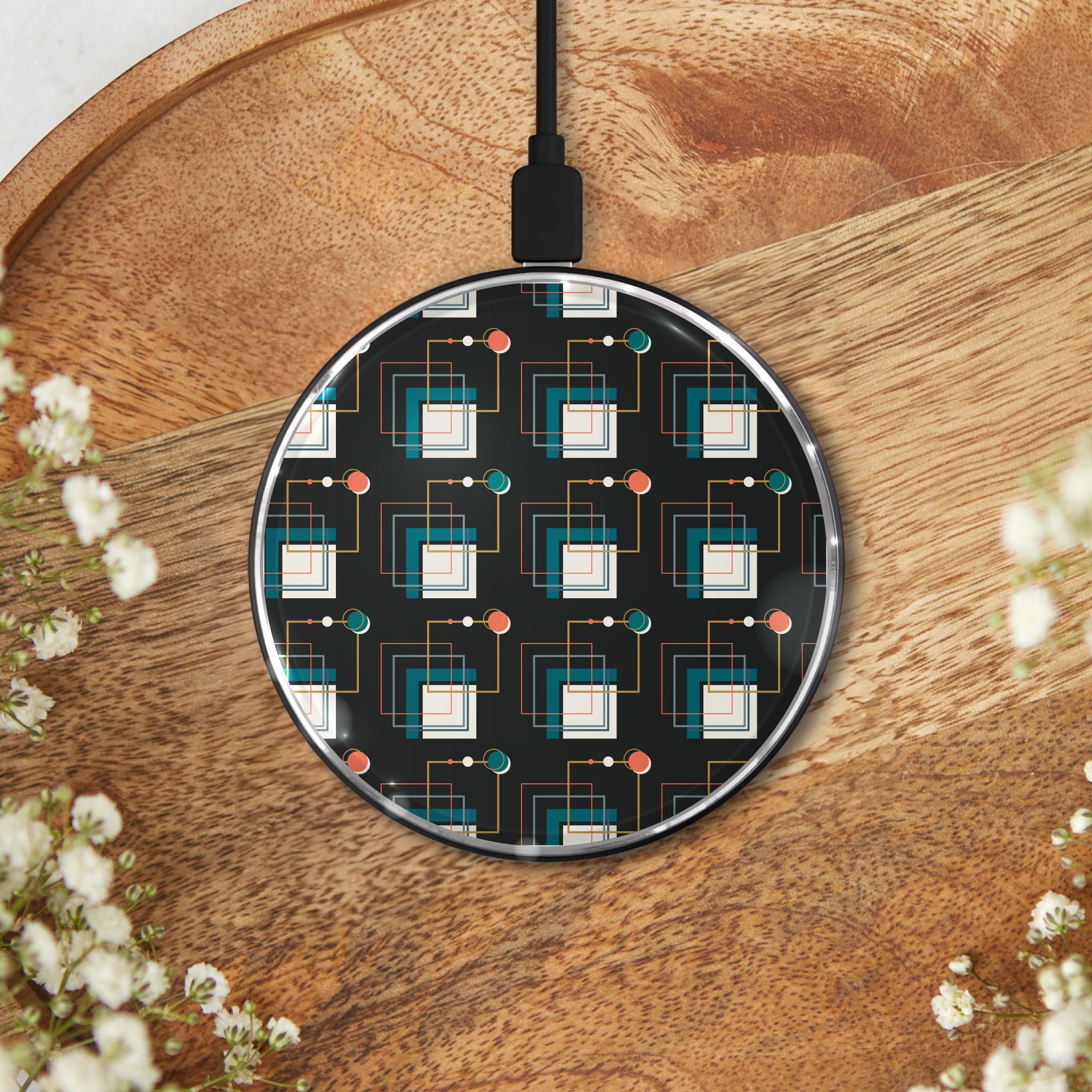 Black geometric-patterned wireless charging pad on a wooden surface, ideal for modern tech lovers