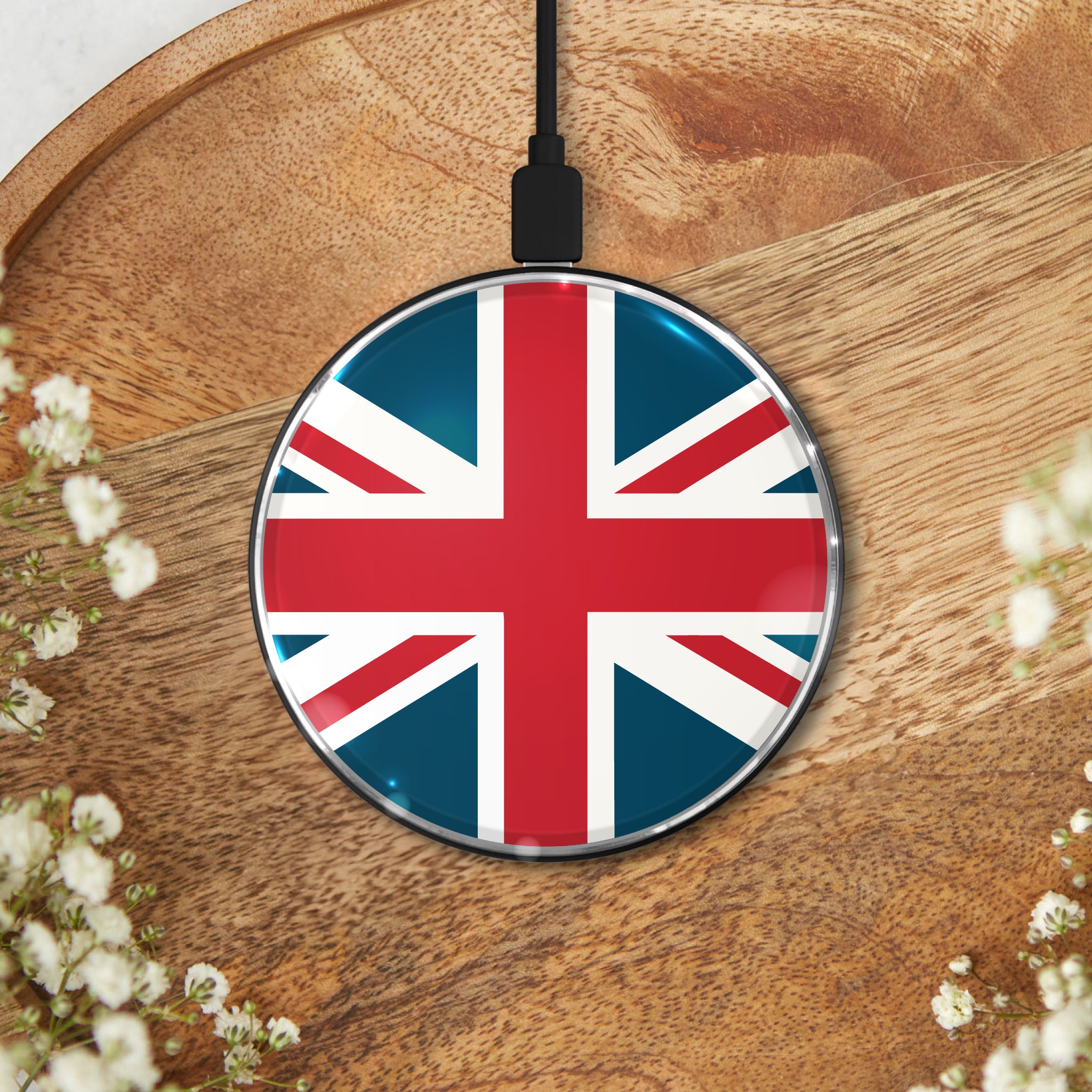 Union Jack wireless charging pad on a wooden surface, featuring a bold British flag design