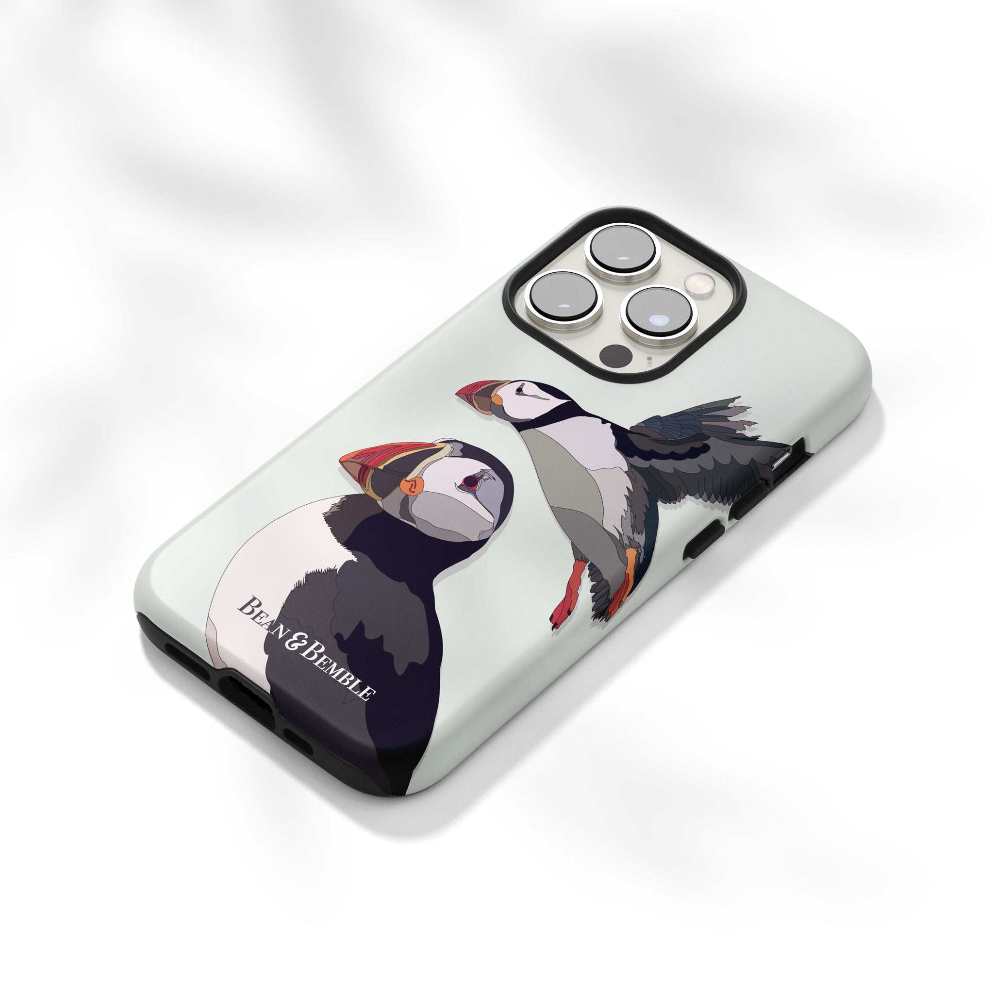 Angled view of the puffins phone case on a white background, highlighting its smooth matte finish