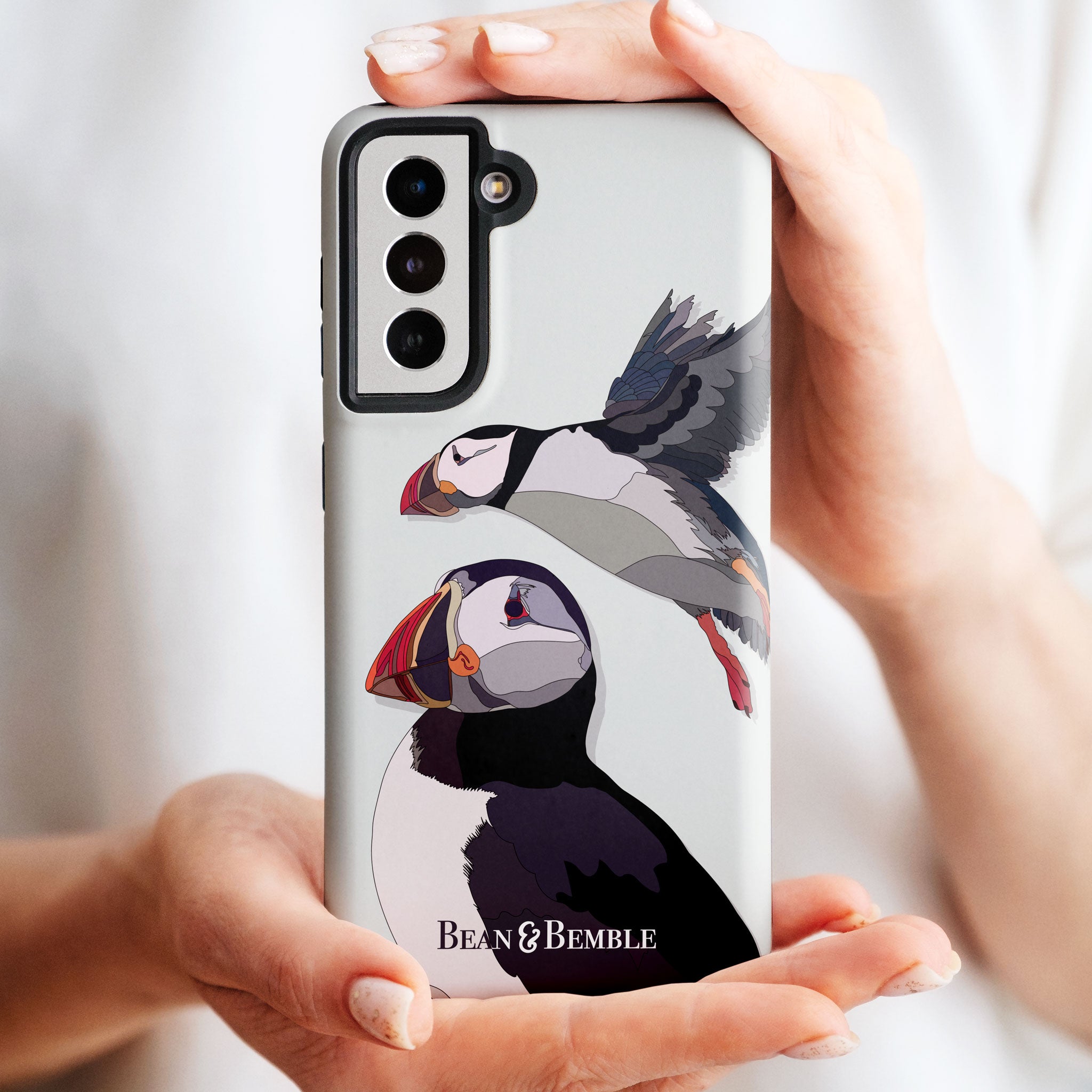 Samsung tough phone case featuring a puffin bird illustration, designed for durability and protection